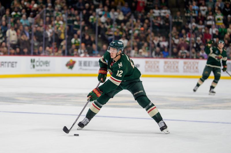 Nov 11, 2025; Saint Paul, Minnesota, USA; Minnesota Wild left wing Matt Boldy (12) controls the puck against San Jose Sharks in overtime at Grand Casino Arena. Mandatory Credit: Matt Blewett-Imagn Images