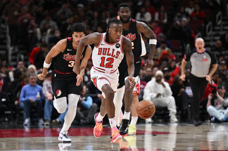 CHICAGO, ILLINOIS - MARCH 18:  Ayo Dosunmu #12 of the Chicago Bulls pushes the ball up court in the second half against the Portland Trail Blazers on March 18, 2024 at United Center in Chicago, Illinois. Chicago defeated Portland 110-107.   NOTE TO USER: User expressly acknowledges and agrees that, by downloading and or using this photograph, User is consenting to the terms and conditions of the Getty Images License Agreement.  (Photo by Jamie Sabau/Getty Images)