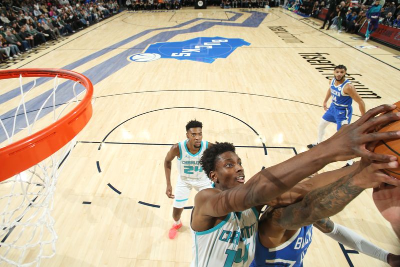 MILWAUKEE, WI - NOVEMBER 23: Moussa Diabate #14 of the Charlotte Hornets blocks the ball during the game against the Milwaukee Bucks on November 23, 2024 at the Fiserv Forum Center in Milwaukee, Wisconsin. NOTE TO USER: User expressly acknowledges and agrees that, by downloading and or using this Photograph, user is consenting to the terms and conditions of the Getty Images License Agreement. Mandatory Copyright Notice: Copyright 2023 NBAE (Photo by Gary Dineen/NBAE via Getty Images).