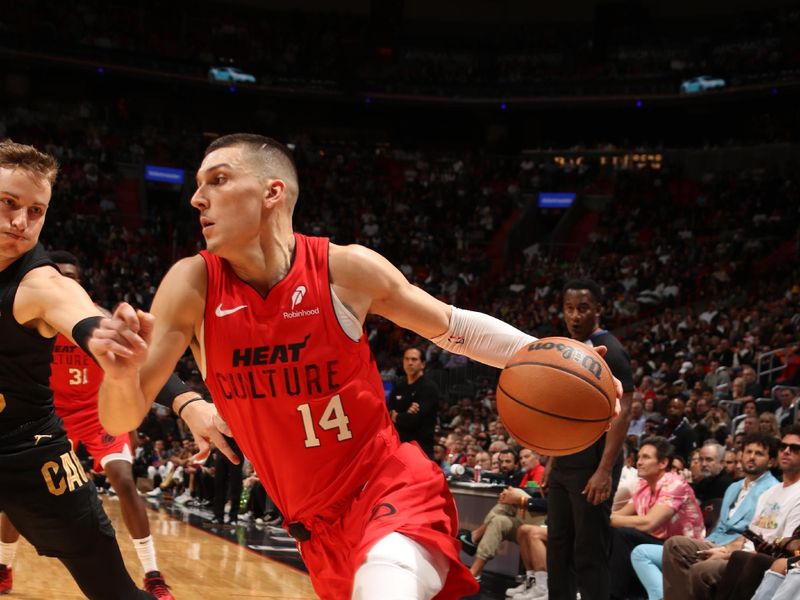 MIAMI, FL - DECEMBER 8: Tyler Herro #14 of the Miami Heat dribbles the ball during the game against the Cleveland Cavaliers on December 8, 2024 at Kaseya Center in Miami, Florida. NOTE TO USER: User expressly acknowledges and agrees that, by downloading and or using this Photograph, user is consenting to the terms and conditions of the Getty Images License Agreement. Mandatory Copyright Notice: Copyright 2024 NBAE (Photo by Issac Baldizon/NBAE via Getty Images)