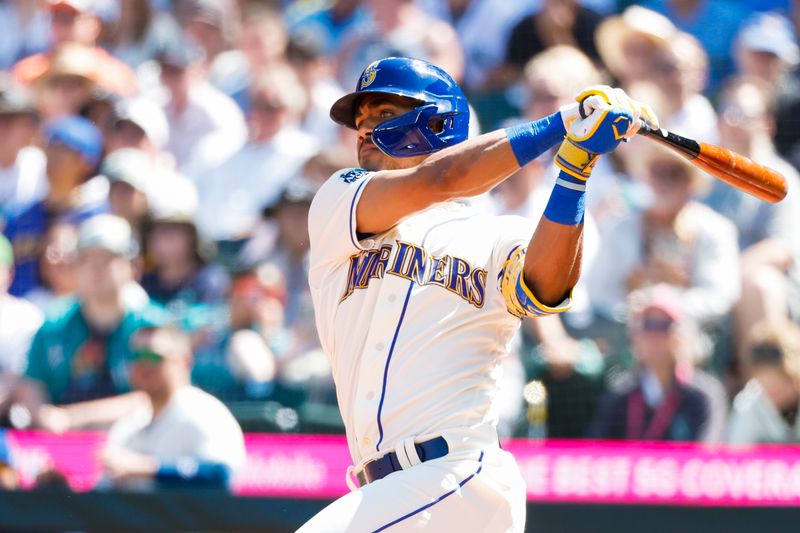 Aug 13, 2023; Seattle, Washington, USA; Seattle Mariners center fielder Julio Rodriguez (44) hits an RBI-double against the Baltimore Orioles during the fifth inning at T-Mobile Park. Mandatory Credit: Joe Nicholson-USA TODAY Sports