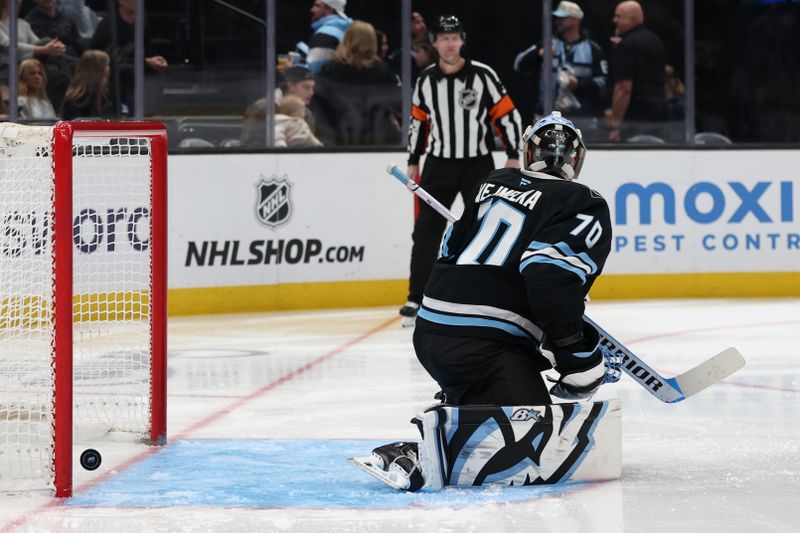 Mar 1, 2026; Salt Lake City, Utah, USA; The Chicago Blackhawks make a shot past Utah Mammoth goaltender Karel Vejmelka (70) during the third period at Delta Center. Mandatory Credit: Rob Gray-Imagn Images