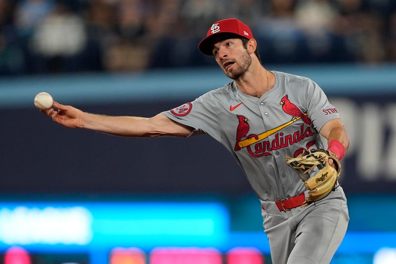 Sep 13, 2024; Toronto, Ontario, CAN; St. Louis Cardinals second baseman Thomas Saggese (25) throws out Toronto Blue Jays right fielder Addison Barger (not pictured) at first base during the 9th inning at Rogers Centre. Mandatory Credit: John E. Sokolowski-Imagn Images