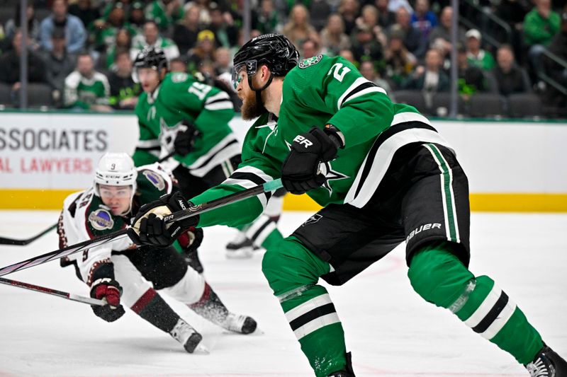 Nov 14, 2023; Dallas, Texas, USA; Dallas Stars defenseman Jani Hakanpaa (2) shoots the puck in the Arizona Coyotes zone during the second period at the American Airlines Center. Mandatory Credit: Jerome Miron-USA TODAY Sports