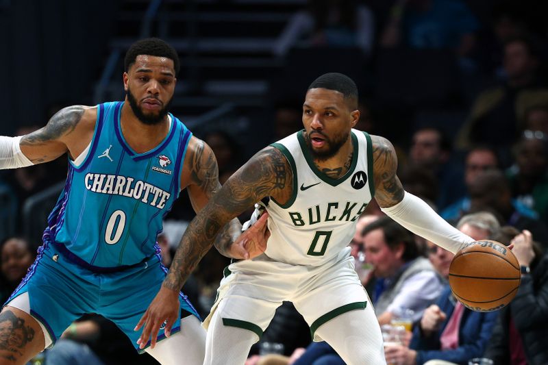 CHARLOTTE, NORTH CAROLINA - FEBRUARY 29: Damian Lillard #0 of the Milwaukee Bucks is closely guarded by Miles Bridges #0 of the Charlotte Hornets during the first half of the game at Spectrum Center on February 29, 2024 in Charlotte, North Carolina. NOTE TO USER: User expressly acknowledges and agrees that, by downloading and or using this photograph, User is consenting to the terms and conditions of the Getty Images License Agreement. (Photo by Jared C. Tilton/Getty Images)