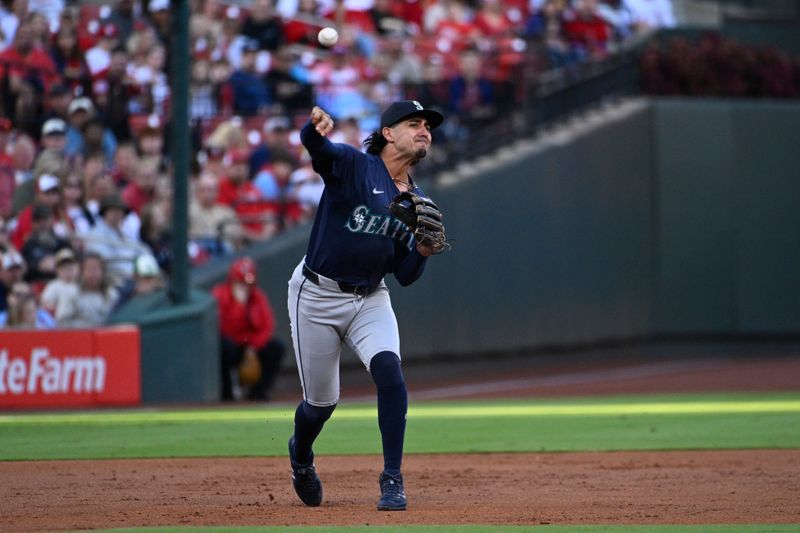 Sep 7, 2024; St. Louis, Missouri, USA; Seattle Mariners first baseman Josh Rojas (4) throws to first base for an out against the St. Louis Cardinals in the first inning at Busch Stadium. Mandatory Credit: Joe Puetz-Imagn Images