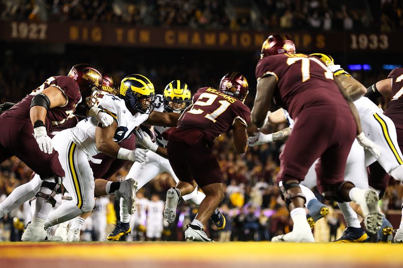 Oct 7, 2023; Minneapolis, Minnesota, USA; Minnesota Golden Gophers running back Bryce Williams (21) runs the ball against the Michigan Wolverines during the second quarter at Huntington Bank Stadium. Mandatory Credit: Matt Krohn-USA TODAY Sports