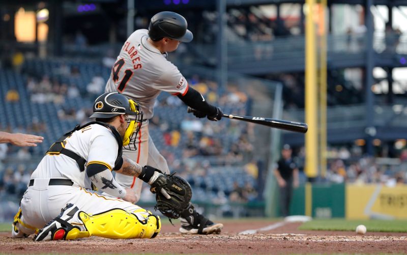 May 21, 2024; Pittsburgh, Pennsylvania, USA;  San Francisco Giants first baseman Wilmer Flores (41) hits a single against the Pittsburgh Pirates during the fifth inning at PNC Park. Mandatory Credit: Charles LeClaire-USA TODAY Sports