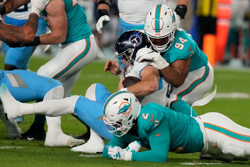 Miami Dolphins defensive tackle Christian Wilkins (94) sacks Tennessee Titans quarterback Will Levis during the first half of an NFL football game, Monday, Dec. 11, 2023, in Miami, Fla. (AP Photo/Lynne Sladky)