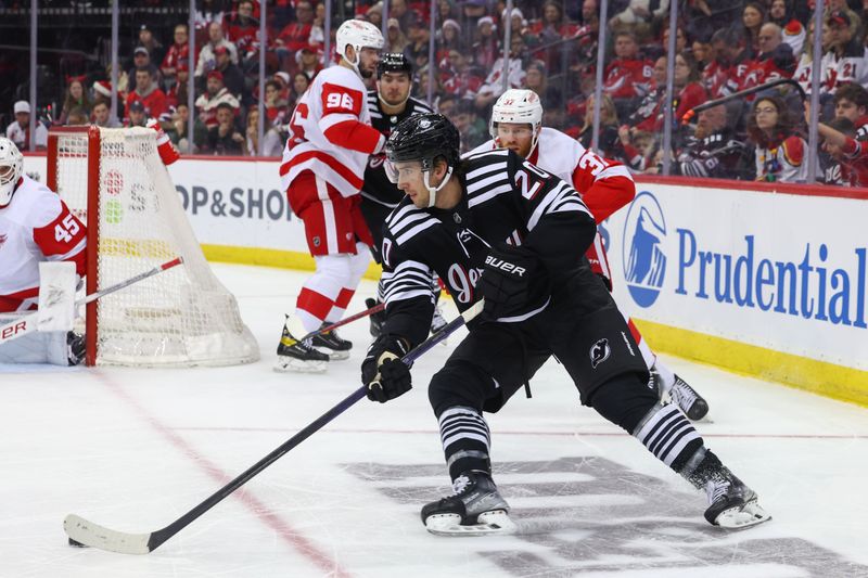 Dec 23, 2023; Newark, New Jersey, USA; New Jersey Devils center Michael McLeod (20) skates with the puck against the Detroit Red Wings during the second period at Prudential Center. Mandatory Credit: Ed Mulholland-USA TODAY Sports