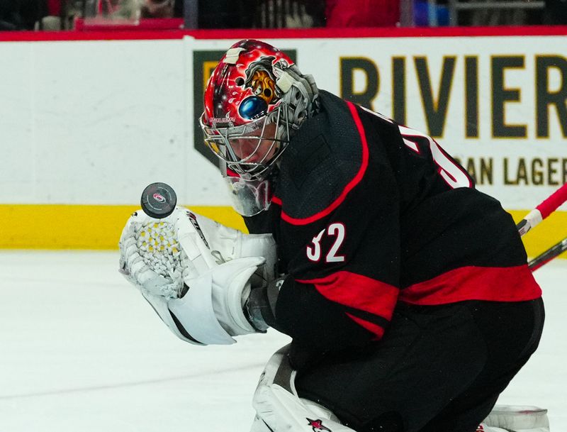 Jan 6, 2024; Raleigh, North Carolina, USA; Carolina Hurricanes goaltender Antti Raanta (32) makes a save against the St. Louis Blues during the second period at PNC Arena. Mandatory Credit: James Guillory-USA TODAY Sports