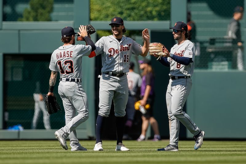 Jul 2, 2023; Denver, Colorado, USA; Detroit Tigers left fielder Eric Haase (13) and center fielder Jake Marisnick (15) and right fielder Matt Vierling (8) celebrate after the game against the Colorado Rockies at Coors Field. Mandatory Credit: Isaiah J. Downing-USA TODAY Sports