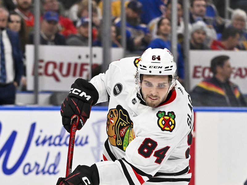 Apr 10, 2024; St. Louis, Missouri, USA;  Chicago Blackhawks left wing Landon Slaggert (84) shoots against the St. Louis Blues during the third period at Enterprise Center. Mandatory Credit: Jeff Curry-USA TODAY Sports