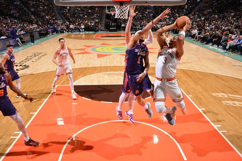 SAN ANTONIO, TX - MARCH 25: Keldon Johnson #3 of the San Antonio Spurs drives to the basket during the game against the Phoenix Suns on March 25, 2024 at the AT&T Center in San Antonio, Texas. NOTE TO USER: User expressly acknowledges and agrees that, by downloading and or using this photograph, user is consenting to the terms and conditions of the Getty Images License Agreement. Mandatory Copyright Notice: Copyright 2024 NBAE (Photos by Jesse D. Garrabrant/NBAE via Getty Images)