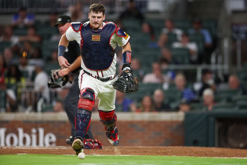 Aug 21, 2024; Atlanta, Georgia, USA; Atlanta Braves catcher Sean Murphy (12) runs to the ball against the Philadelphia Phillies in the ninth inning at Truist Park. Mandatory Credit: Brett Davis-USA TODAY Sports
