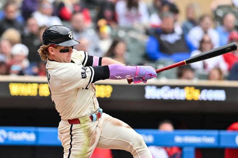 Apr 27, 2025; Minneapolis, Minnesota, USA; Minnesota Twins outfielder Harrison Bader (12) hits a double off Los Angeles Angels pitcher Ryan Zeferjahn (not pictured) during the seventh inning at Target Field. Bader would later come around to score. Mandatory Credit: Jeffrey Becker-Imagn Images