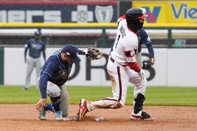 Apr 30, 2023; Chicago, Illinois, USA; Chicago White Sox shortstop Elvis Andrus (1) is tagged out at second base by Tampa Bay Rays second baseman Brandon Lowe (8) during the sixth inning at Guaranteed Rate Field. Mandatory Credit: David Banks-USA TODAY Sports