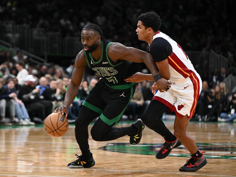 BOSTON, MASSACHUSETTS - DECEMBER 02: Jaylen Brown #7 of the Boston Celtics dribbles the ball to the basket against Dru Smith #12 of the Miami Heat during the third quarter at the TD Garden on December 02, 2024 in Boston, Massachusetts. NOTE TO USER: User expressly acknowledges and agrees that, by downloading and or using this photograph, User is consenting to the terms and conditions of the Getty Images License Agreement. (Photo by Brian Fluharty/Getty Images)