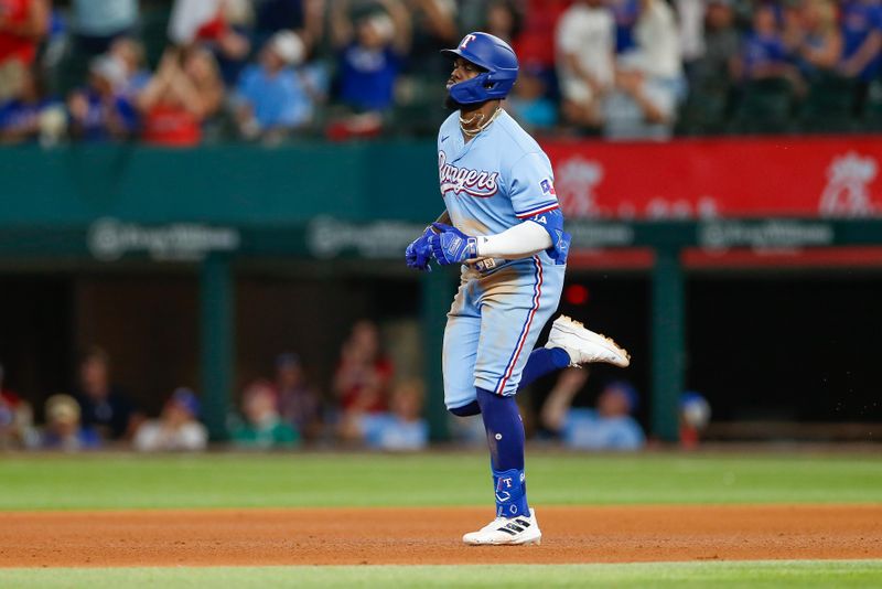 Aug 6, 2023; Arlington, Texas, USA; Texas Rangers right fielder Adolis Garcia (53) hits a home run during the eighth inning against the Miami Marlins at Globe Life Field. Mandatory Credit: Andrew Dieb-USA TODAY Sports