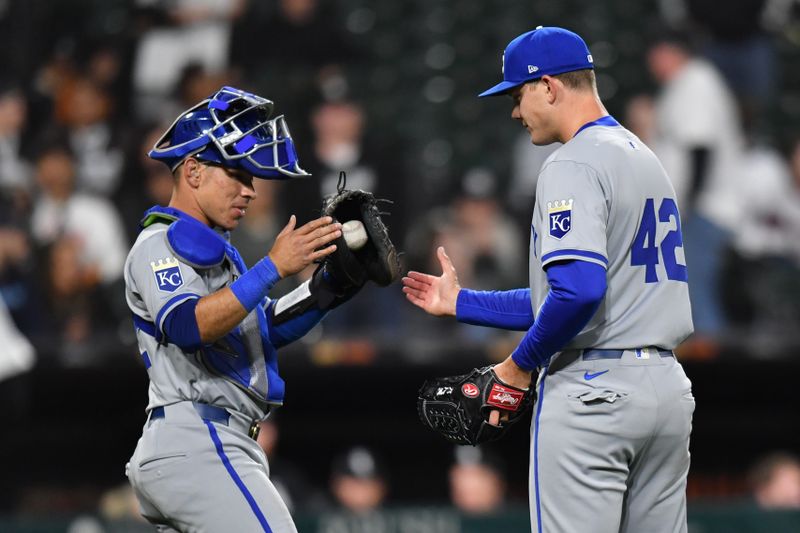 Apr 15, 2024; Chicago, Illinois, USA; Kansas City Royals catcher Freddy Fermin (34) celebrates with relief pitcher James McArthur (66) after defeating the Chicago White Sox at Guaranteed Rate Field. All players wore #42 in honor of Jackie Robinson Day. Mandatory Credit: Patrick Gorski-USA TODAY Sports