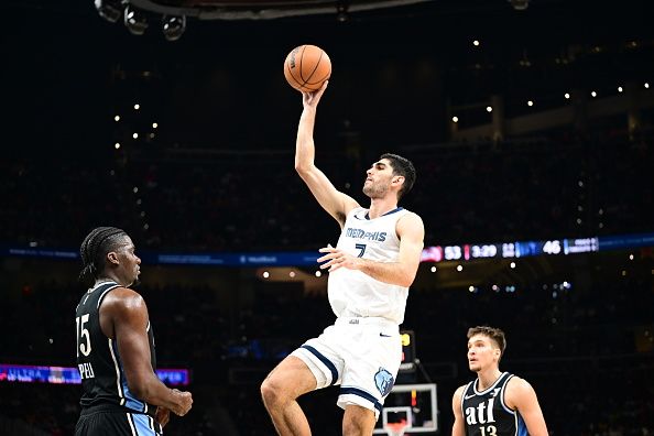 ATLANTA, GA - DECEMBER 23: Santi Aldama #7 of the Memphis Grizzlies shoots the ball during the game against the Atlanta Hawks on December 23, 2023 at State Farm Arena in Atlanta, Georgia.  NOTE TO USER: User expressly acknowledges and agrees that, by downloading and/or using this Photograph, user is consenting to the terms and conditions of the Getty Images License Agreement. Mandatory Copyright Notice: Copyright 2023 NBAE (Photo by Adam Hagy/NBAE via Getty Images)