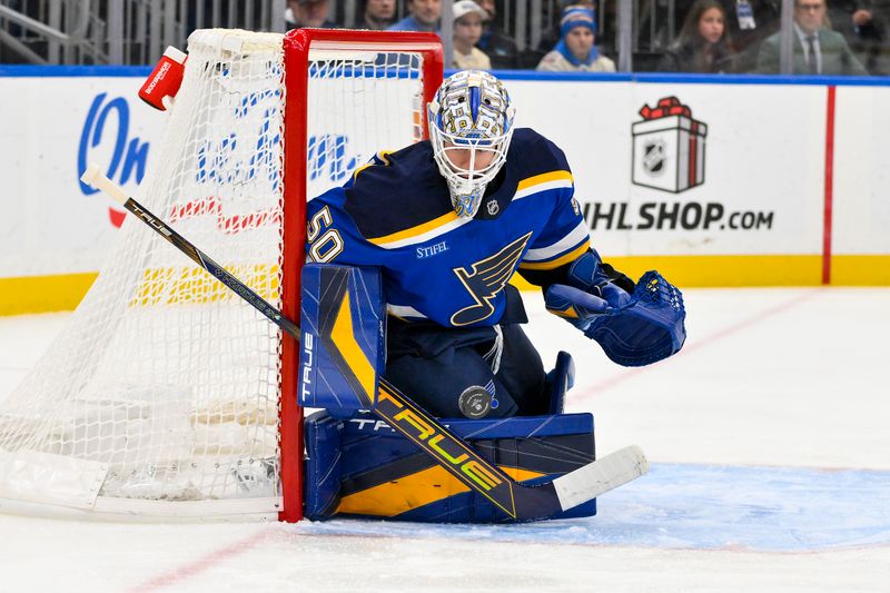 Jan 3, 2025; St. Louis, Missouri, USA;  St. Louis Blues goaltender Jordan Binnington (50) defends the net against the Ottawa Senators during the first period at Enterprise Center. Mandatory Credit: Jeff Curry-Imagn Images