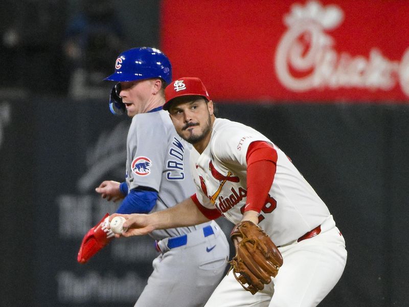 Jun 24, 2025; St. Louis, Missouri, USA;  St. Louis Cardinals third baseman Nolan Arenado (28) barehands a ground ball hit by Chicago Cubs shortstop Dansby Swanson (not pictured) during the ninth inning at Busch Stadium. Mandatory Credit: Jeff Curry-Imagn Images