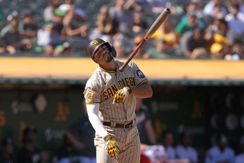 Sep 17, 2023; Oakland, California, USA; San Diego Padres shortstop Xander Bogaerts (2) tosses his bat after flying out against the Oakland Athletics during the seventh inning at Oakland-Alameda County Coliseum. Mandatory Credit: Darren Yamashita-USA TODAY Sports