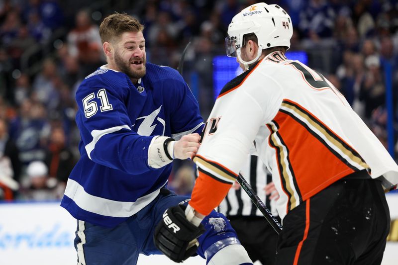 Jan 13, 2024; Tampa, Florida, USA;  Tampa Bay Lightning left wing Austin Watson (51) shoves Anaheim Ducks left wing Ross Johnston (44) in the second period at Amalie Arena. Mandatory Credit: Nathan Ray Seebeck-USA TODAY Sports