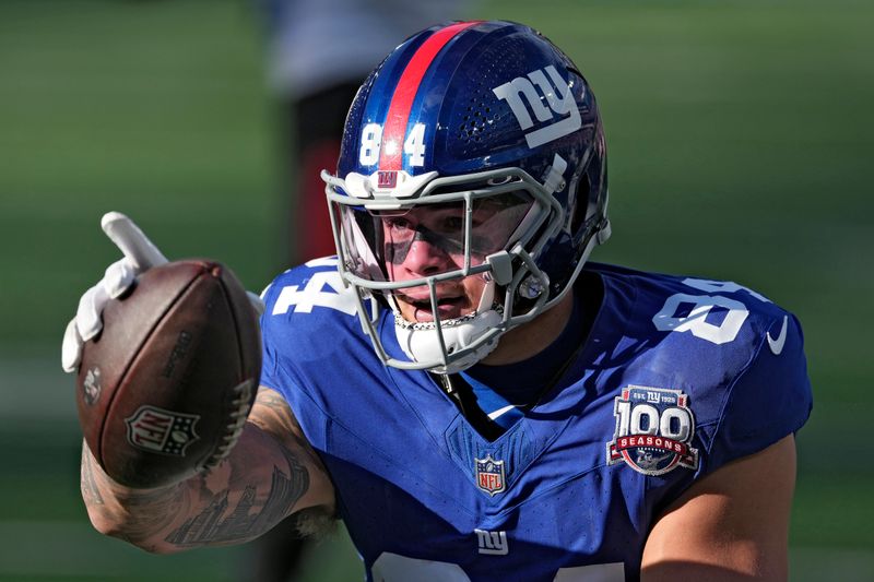 New York Giants tight end Theo Johnson (84) celebrates a first down against the Tampa Bay Buccaneers during the first half of an NFL football game Sunday, Nov. 24, 2024, in East Rutherford, N.J. (AP Photo/Seth Wenig)