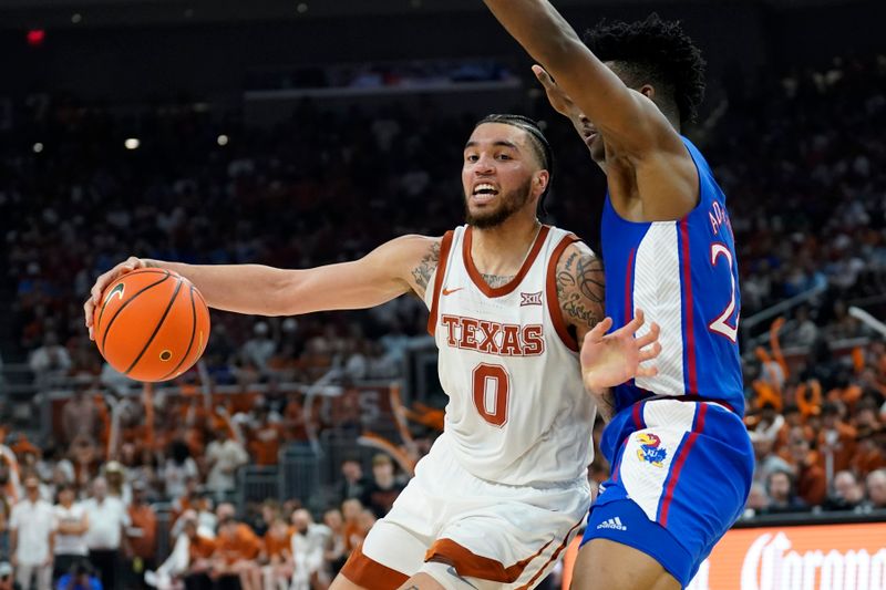 Mar 4, 2023; Austin, Texas, USA; Texas Longhorns forward Timmy Allen (0) drives to the basket against Kansas Jayhawks forward KJ Adams Jr. (24) during the first half at Moody Center. Mandatory Credit: Scott Wachter-USA TODAY Sports