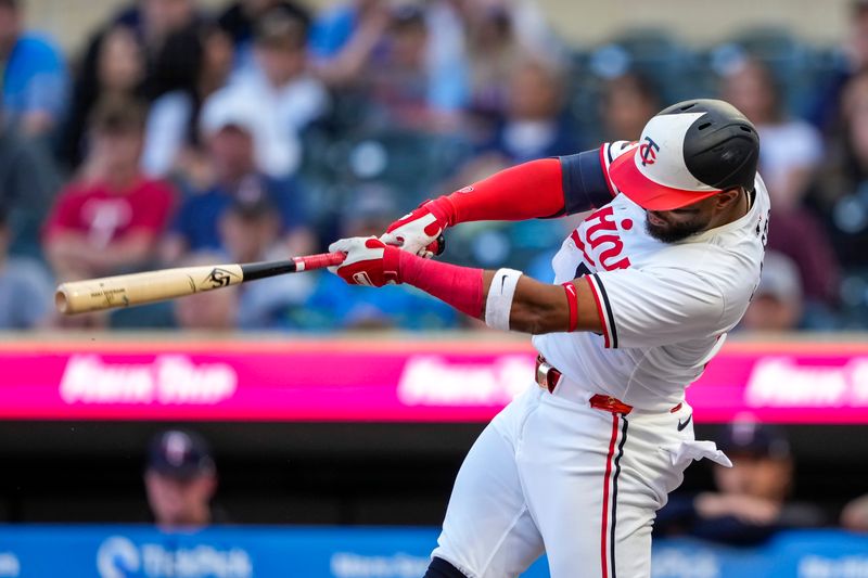 May 8, 2024; Minneapolis, Minnesota, USA; Minnesota Twins center fielder Willi Castro (50) hits a solo home run against the Seattle Mariners in the second inning at Target Field. Mandatory Credit: Jesse Johnson-USA TODAY Sports