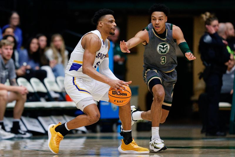 Feb 9, 2024; Fort Collins, Colorado, USA; San Jose State Spartans guard Myron Amey Jr. (0) controls the ball as Colorado State Rams guard Josiah Strong (3) guards in the second half at Moby Arena. Mandatory Credit: Isaiah J. Downing-USA TODAY Sports