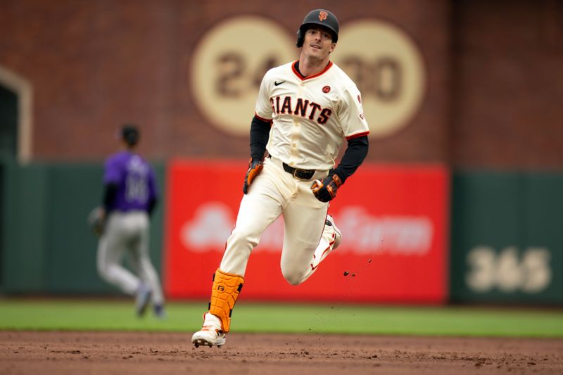 Jul 27, 2024; San Francisco, California, USA; San Francisco Giants right fielder Mike Yastrzemski (5) legs out a triple against the Colorado Rockies during the second inning at Oracle Park. Mandatory Credit: D. Ross Cameron-USA TODAY Sports