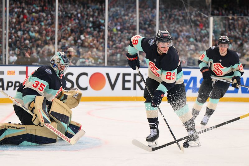 Jan 1, 2024; Seattle, Washington, USA; Seattle Kraken defenseman Vince Dunn (29) plays the puck during the 3rd period against the Vegas Golden Knights in the 2024 Winter Classic ice hockey game at T-Mobile Park. Mandatory Credit: Steven Bisig-USA TODAY Sports