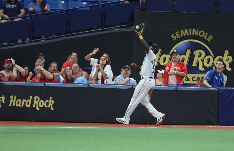 Aug 10, 2023; St. Petersburg, Florida, USA; Tampa Bay Rays left fielder Randy Arozarena (56) catches a fly foul ball for an out against the St. Louis Cardinals third inning at Tropicana Field. Mandatory Credit: Kim Klement Neitzel-USA TODAY Sports