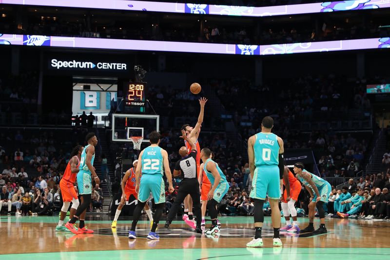 CHARLOTTE, NC - APRIL 7: Chet Holmgren #7 of the Oklahoma City Thunder goes for the opening tip-off during the game against the Charlotte Hornets on April 7, 2024 at Spectrum Center in Charlotte, North Carolina. NOTE TO USER: User expressly acknowledges and agrees that, by downloading and or using this photograph, User is consenting to the terms and conditions of the Getty Images License Agreement.  Mandatory Copyright Notice:  Copyright 2024 NBAE (Photo by Brock Williams-Smith/NBAE via Getty Images)