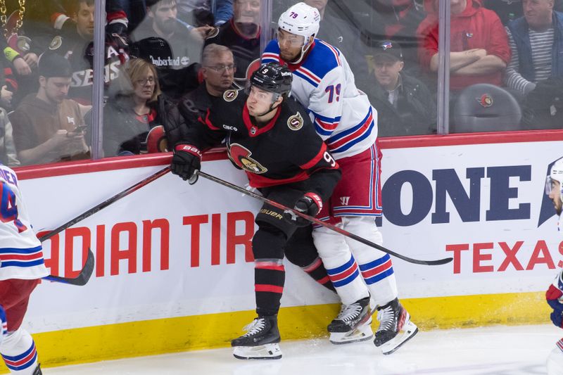 Jan 27, 2024; Ottawa, Ontario, CAN; Ottawa Senators center Josh Norris (9) is checked by New York Rangers defenseman K'Andrre Miller (79) in the third perod at the Canadian Tire Centre. Mandatory Credit: Marc DesRosiers-USA TODAY Sports