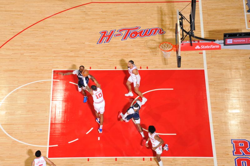 HOUSTON, TX - MARCH 31: Jabari Smith Jr. #10 of the Houston Rockets goes up for the rebound during the game against the Dallas Mavericks on March 31, 2024 at the Toyota Center in Houston, Texas. NOTE TO USER: User expressly acknowledges and agrees that, by downloading and or using this photograph, User is consenting to the terms and conditions of the Getty Images License Agreement. Mandatory Copyright Notice: Copyright 2024 NBAE (Photo by Logan Riely/NBAE via Getty Images)