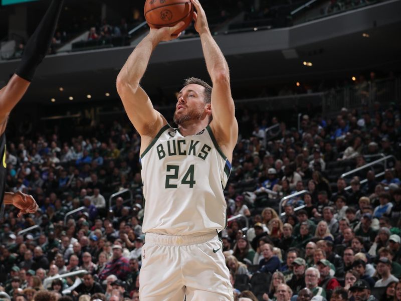 MILWAUKEE, WI - NOVEMBER 7: Pat Connaughton #24 of the Milwaukee Bucks shoots a three point basket during the game against the Utah Jazz on November 7, 2024 at Fiserv Forum Center in Milwaukee, Wisconsin. NOTE TO USER: User expressly acknowledges and agrees that, by downloading and or using this Photograph, user is consenting to the terms and conditions of the Getty Images License Agreement. Mandatory Copyright Notice: Copyright 2024 NBAE (Photo by Gary Dineen/NBAE via Getty Images).