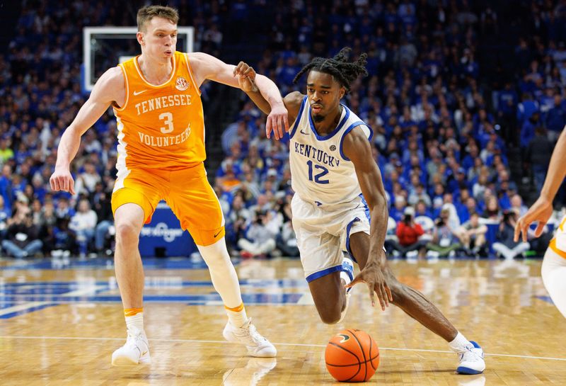 Feb 3, 2024; Lexington, Kentucky, USA; Kentucky Wildcats guard Antonio Reeves (12) drives to the basket around Tennessee Volunteers guard Dalton Knecht (3) during the second half at Rupp Arena at Central Bank Center. Mandatory Credit: Jordan Prather-USA TODAY Sports