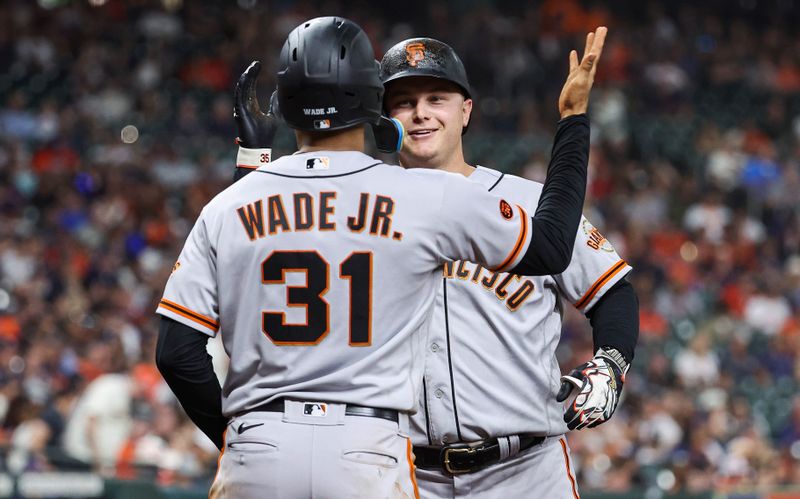 May 1, 2023; Houston, Texas, USA; San Francisco Giants designated hitter Joc Pederson (23) celebrates with first baseman LaMonte Wade Jr. (31) after hitting a home run during the third inning against the Houston Astros at Minute Maid Park. Mandatory Credit: Troy Taormina-USA TODAY Sports