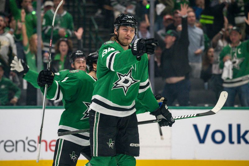 May 9, 2024; Dallas, Texas, USA; Dallas Stars center Roope Hintz (24) and center Logan Stankoven (11) celebrate after Hintz scores a goal against the Colorado Avalanche during the second period in game two of the second round of the 2024 Stanley Cup Playoffs at American Airlines Center. Mandatory Credit: Jerome Miron-USA TODAY Sports