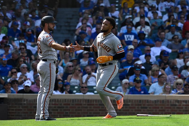 Sep 6, 2023; Chicago, Illinois, USA;  San Francisco Giants left fielder Los Matos (29) high fives San Francisco Giants shortstop Paul DeJong (18) after he scores against the Chicago Cubs during the seventh inning at Wrigley Field. Mandatory Credit: Matt Marton-USA TODAY Sports