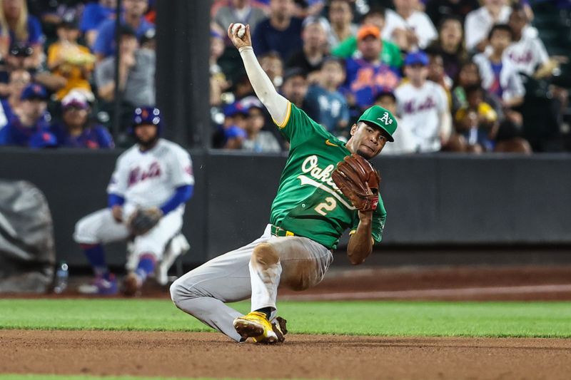 Aug 14, 2024; New York City, New York, USA;  Oakland Athletics third baseman Darell Hernaiz (2) attempts to throw a runner out at first base in the seventh inning against the New York Mets at Citi Field. Mandatory Credit: Wendell Cruz-USA TODAY Sports