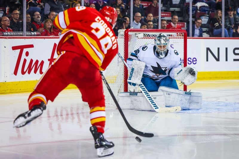 Apr 12, 2023; Calgary, Alberta, CAN; San Jose Sharks goaltender Kaapo Kahkonen (36) makes a save against Calgary Flames right wing Matt Coronato (39) during the second period at Scotiabank Saddledome. Mandatory Credit: Sergei Belski-USA TODAY Sports