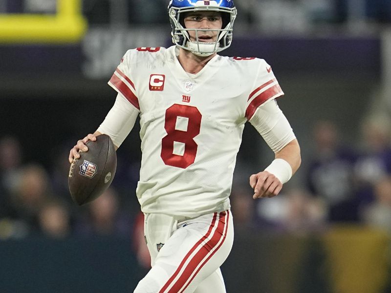 New York Giants quarterback Daniel Jones (8) runs down the field during the first half of an NFL wild-card football game against the Minnesota Vikings, Sunday, Jan. 15, 2023, in Minneapolis. (AP Photo/Abbie Parr)