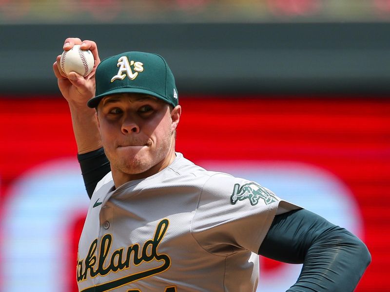 Jun 16, 2024; Minneapolis, Minnesota, USA; Oakland Athletics pitcher Vinny Nittoli (64) delivers a pitch against the Minnesota Twins during the fifth inning of game one of a double header at Target Field. Mandatory Credit: Matt Krohn-USA TODAY Sports