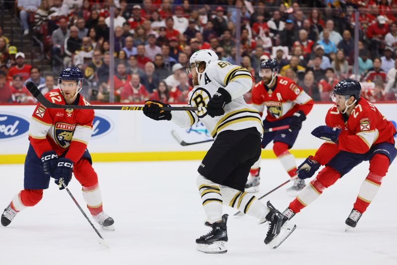 May 14, 2024; Sunrise, Florida, USA; Boston Bruins right wing David Pastrnak (88) watches his shot against the Florida Panthers during the first period in game five of the second round of the 2024 Stanley Cup Playoffs at Amerant Bank Arena. Mandatory Credit: Sam Navarro-USA TODAY Sports