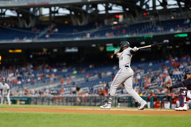 Sep 19, 2023; Washington, District of Columbia, USA; Chicago White Sox center fielder Luis Robert Jr. (88) singles against the Washington Nationals during the first inning at Nationals Park. Mandatory Credit: Geoff Burke-USA TODAY Sports